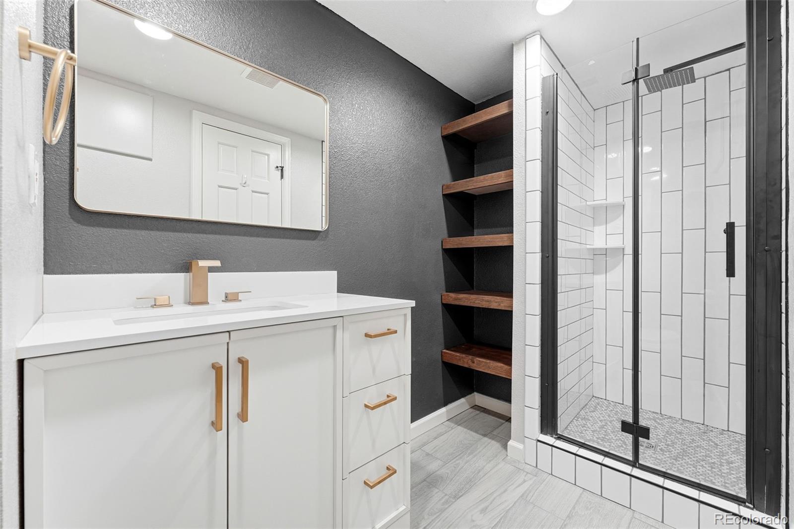 9426 Princeton Circle Highlands Ranch, CO 80130 - Photo 43 of 50 a bathroom with a sink a toilet and shower