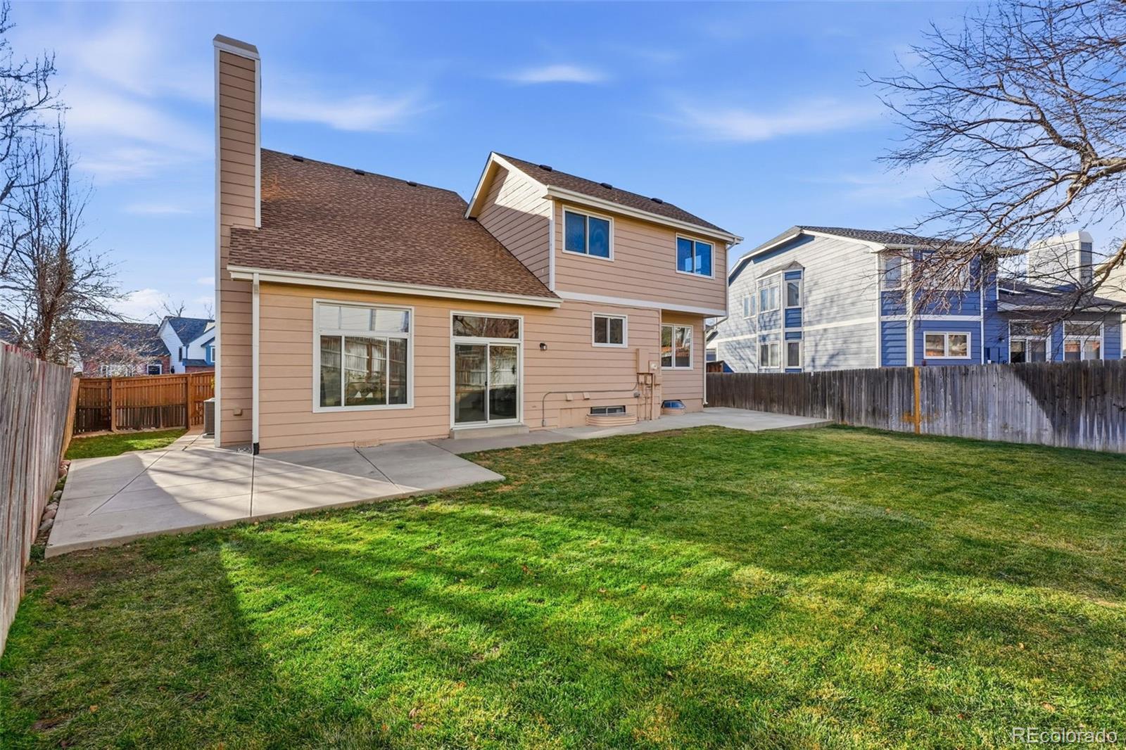 9426 Princeton Circle Highlands Ranch, CO 80130 - Photo 46 of 50 a front view of house with yard and outdoor seating