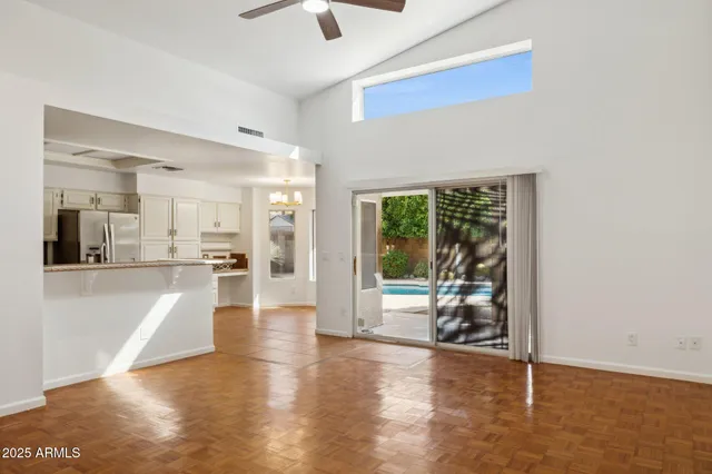 a living room with fireplace furniture and a chandelier