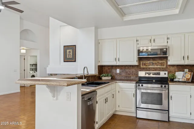 a view of a livingroom with furniture wooden floor and window
