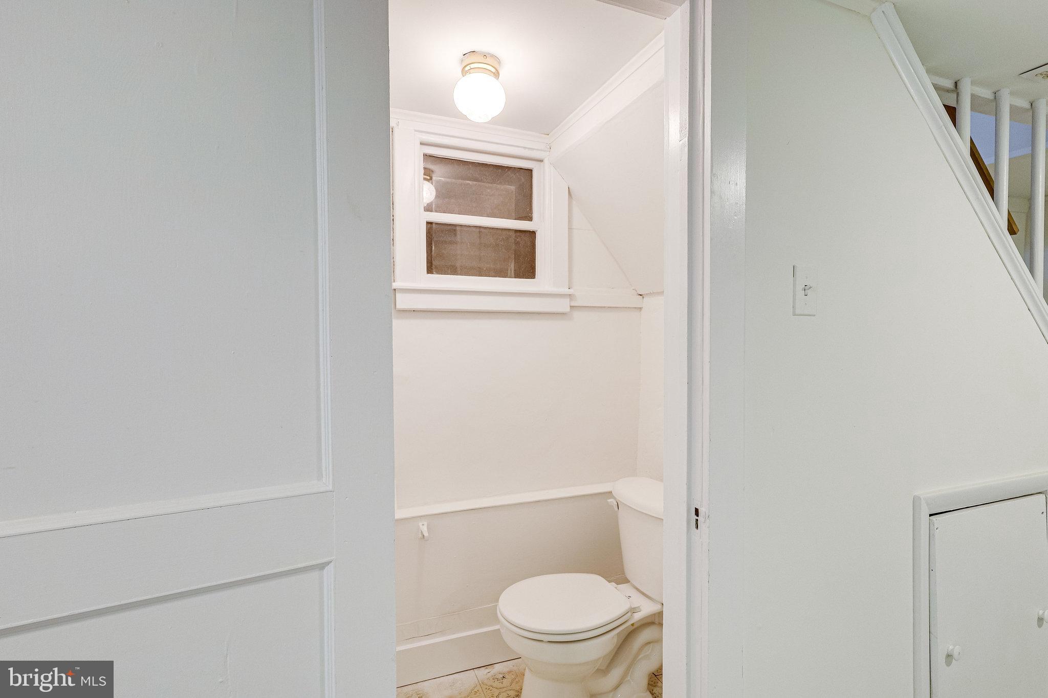 2431 33rd Street Southeast Washington, DC 20020 - Photo 30 of 36 Lower level bath - toilet