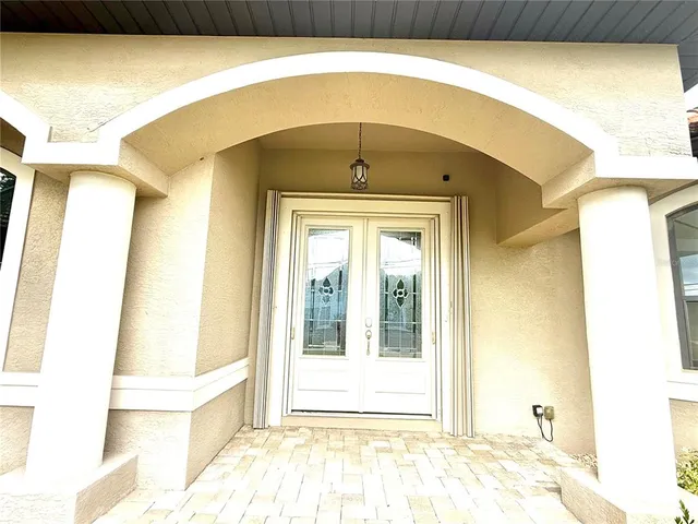 a front view of a house with a swimming pool