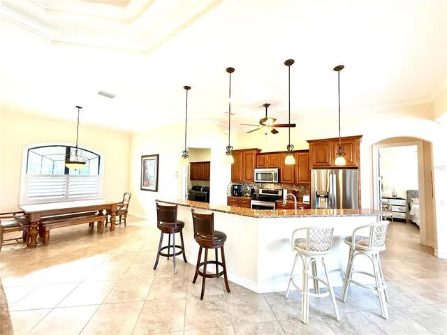 a view of living room with furniture and floor to ceiling window