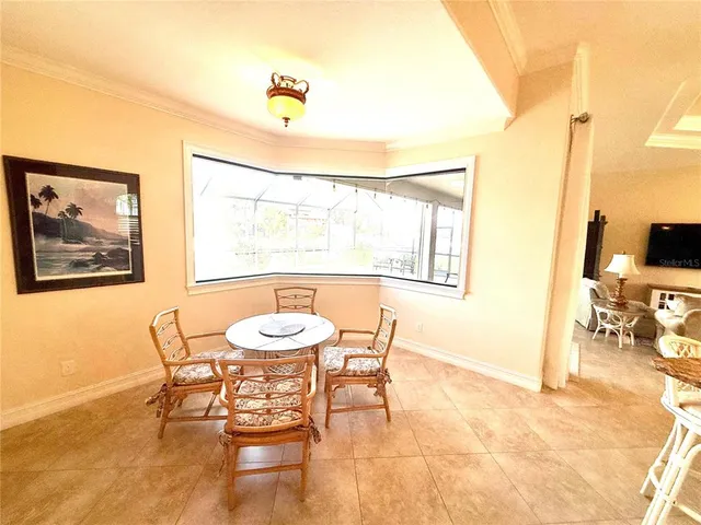 a dining room with furniture and window