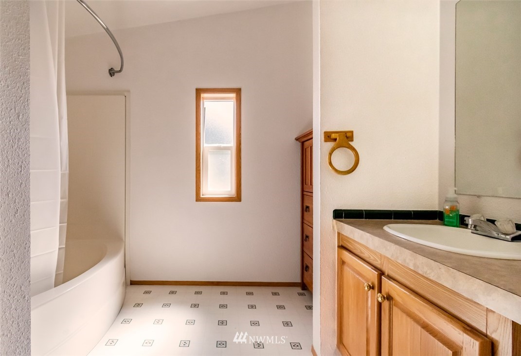 322 O Brien Road Port Angeles, WA 98362 - Photo 18 of 37 a bathroom with a sink and a mirror