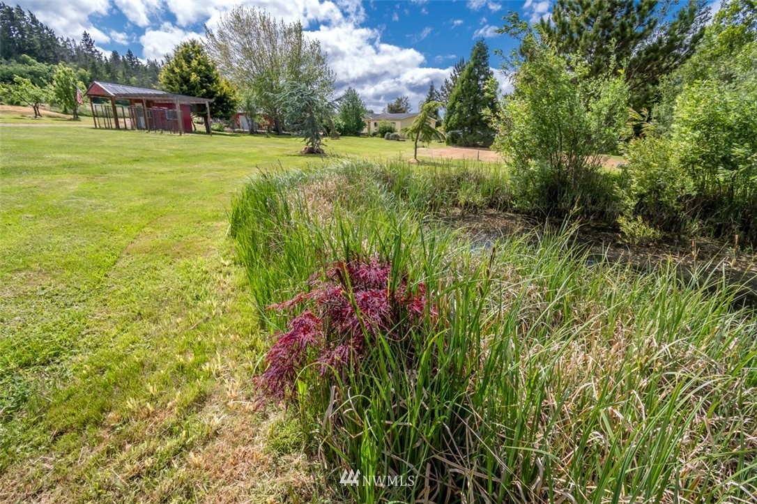 322 O Brien Road Port Angeles, WA 98362 - Photo 37 of 37 a view of a lake with a building in the background