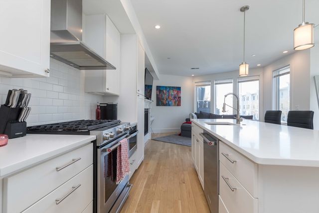 a kitchen with a stove and a sink