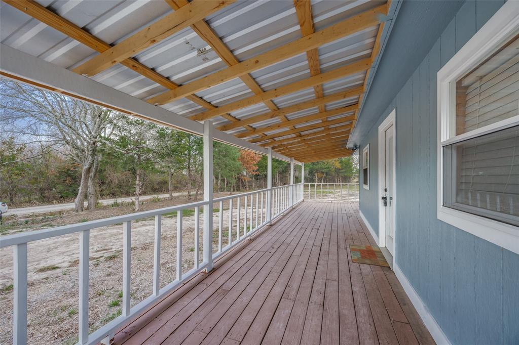 1250 County Road 4120 Bonham, TX 75418 - Photo 5 of 27 a view of balcony with wooden floor