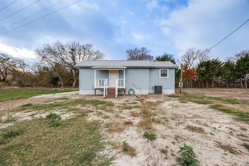 1250 County Road 4120 Bonham, TX 75418 - Photo 8 of 27 a view of a house with backyard