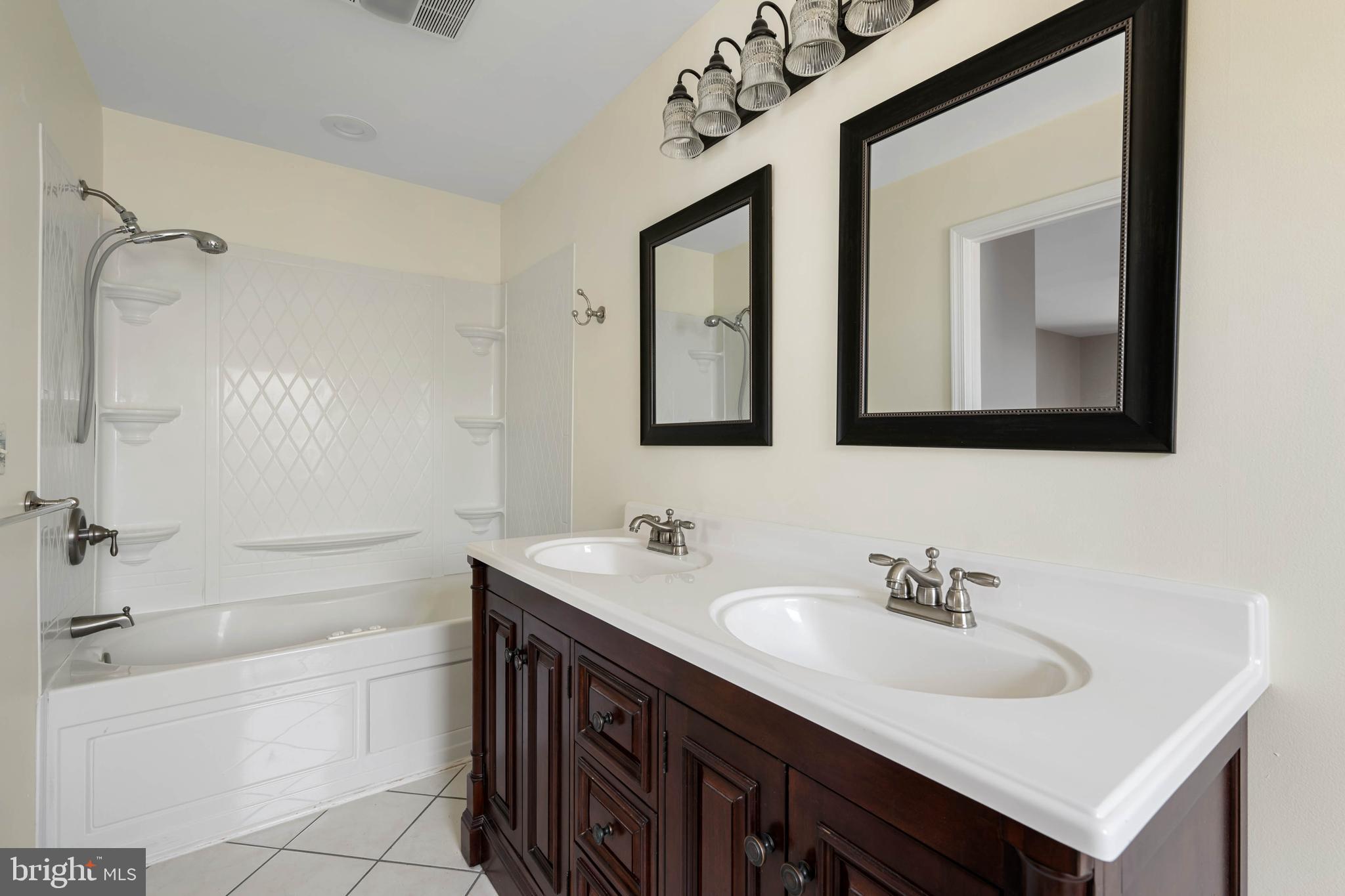 11 Arnell Road Rehoboth Beach, DE 19971 - Photo 16 of 46 a bathroom with a sink and a mirror