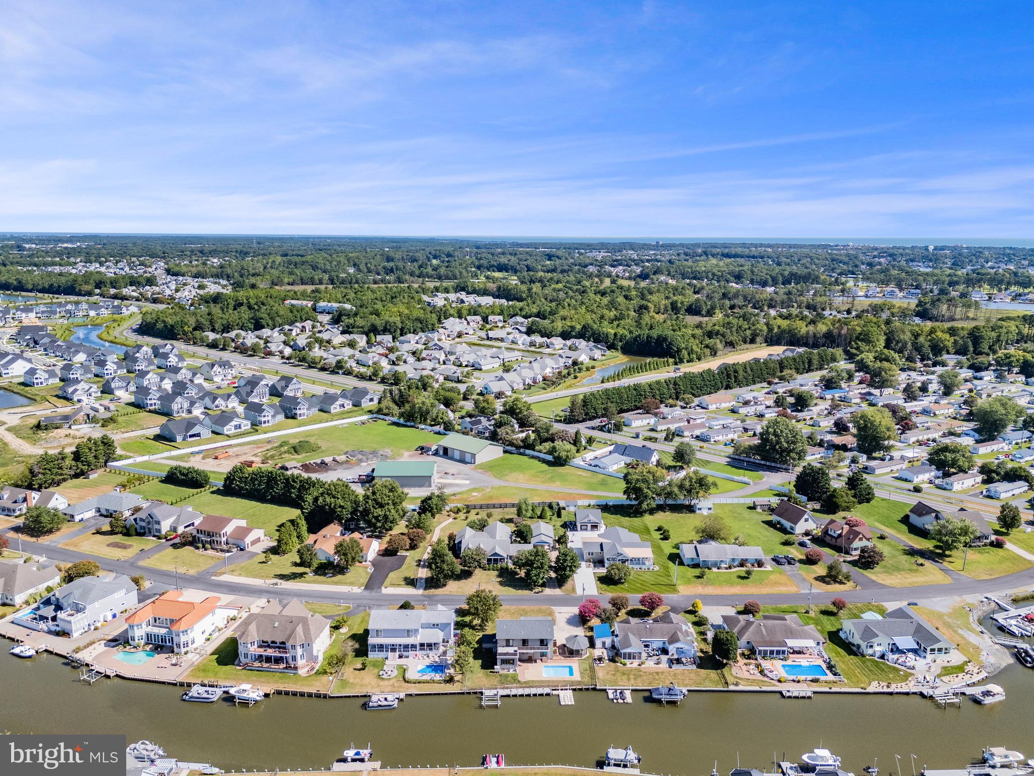 11 Arnell Road Rehoboth Beach, DE 19971 - Photo 42 of 46 an aerial view of a city with lots of residential buildings ocean and mountain view in back