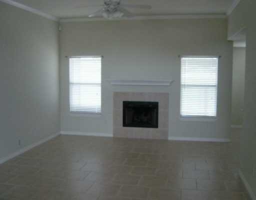 16002 Cuttysark Street Corpus Christi, TX 78418 - Photo 3 of 7 an empty room with a fireplace