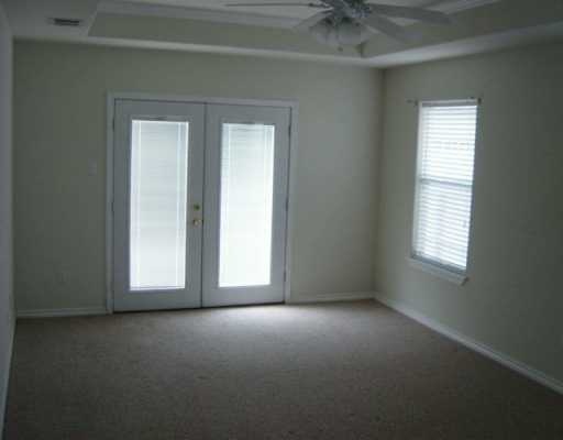 16002 Cuttysark Street Corpus Christi, TX 78418 - Photo 5 of 7 an empty room that has a window