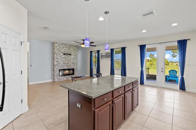 a view of an empty room with a fireplace