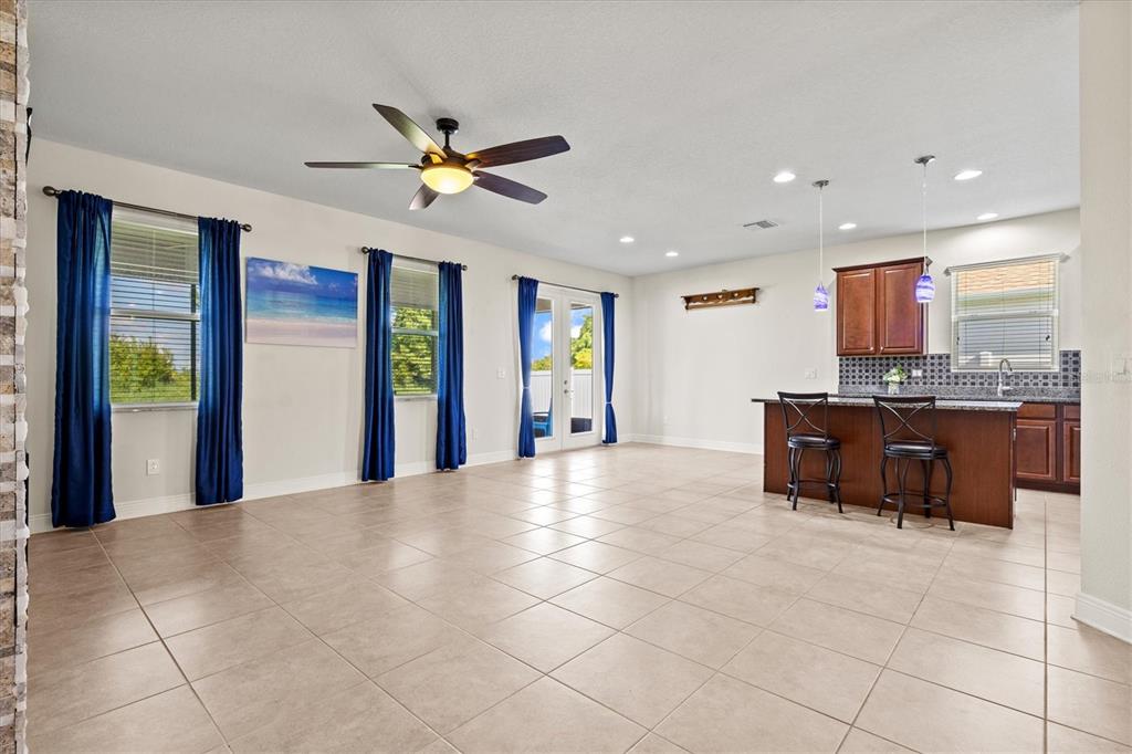 7923 111th Terrace East Parrish, FL 34219 - Photo 19 of 80 a view of kitchen with stainless steel appliances granite countertop a refrigerator and a sink