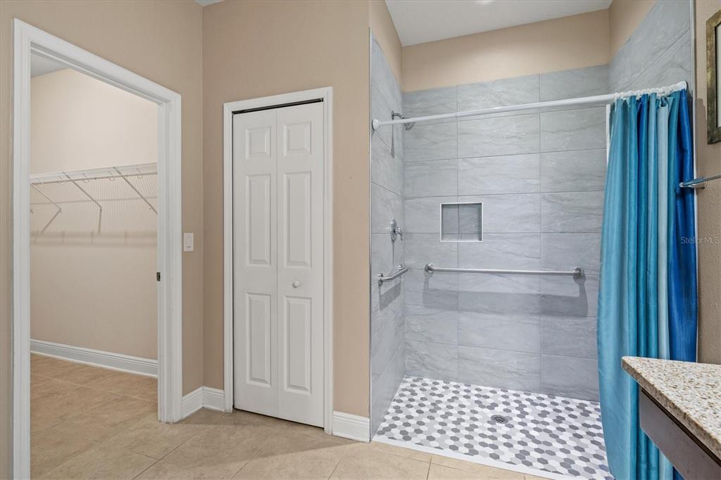 7923 111th Terrace East Parrish, FL 34219 - Photo 26 of 80 a bathroom with a glass door shower