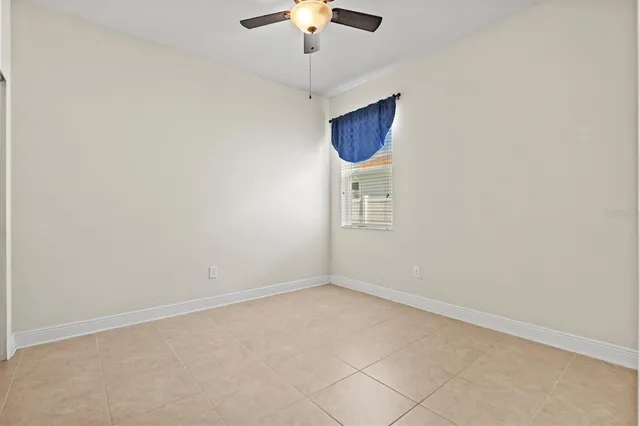 an aerial view of a house with a garden and a car parked