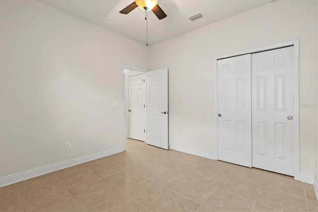 an aerial view of a house with a garden and swimming pool