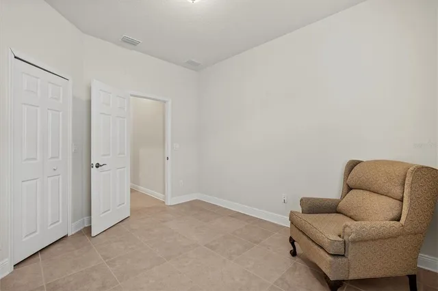 a view of a livingroom with furniture and a window