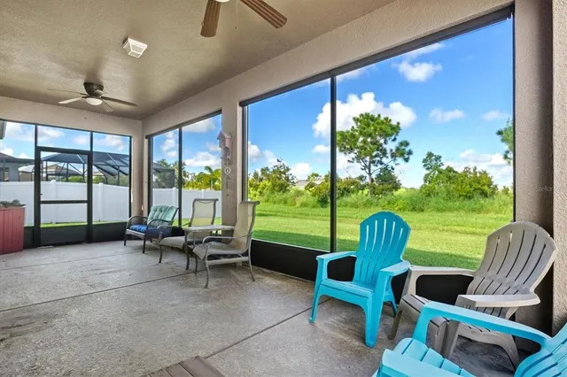a view of a swimming pool with a outdoor seating