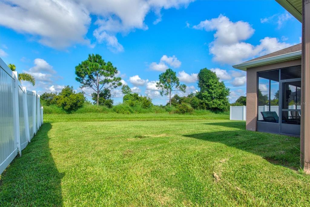 7923 111th Terrace East Parrish, FL 34219 - Photo 43 of 80 a view of a building with a big yard