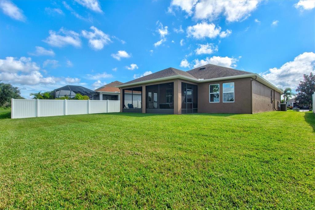 7923 111th Terrace East Parrish, FL 34219 - Photo 44 of 80 a view of a house with a yard