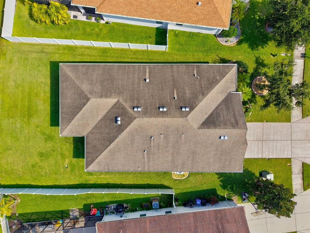 7923 111th Terrace East Parrish, FL 34219 - Photo 46 of 80 an aerial view of a house with a garden and a car parked