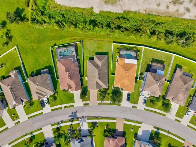 a view of a swimming pool with outdoor seating