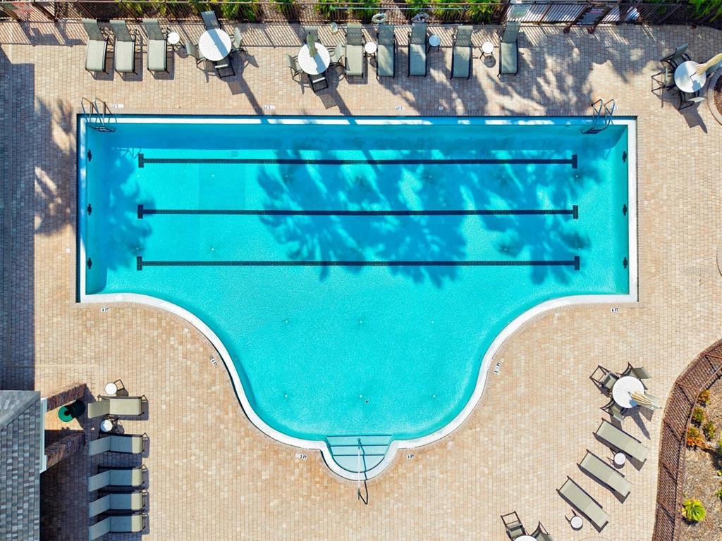 7923 111th Terrace East Parrish, FL 34219 - Photo 57 of 80 a view of a swimming pool with a outdoor seating