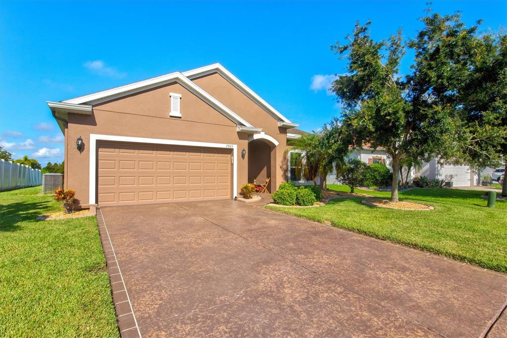 7923 111th Terrace East Parrish, FL 34219 - Photo 6 of 80 a front view of house with yard and green space