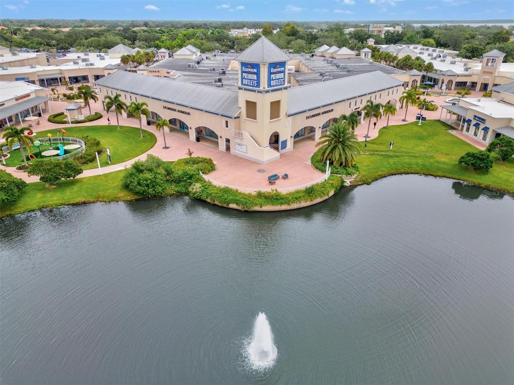7923 111th Terrace East Parrish, FL 34219 - Photo 64 of 80 an aerial view of a house with a garden and lake view