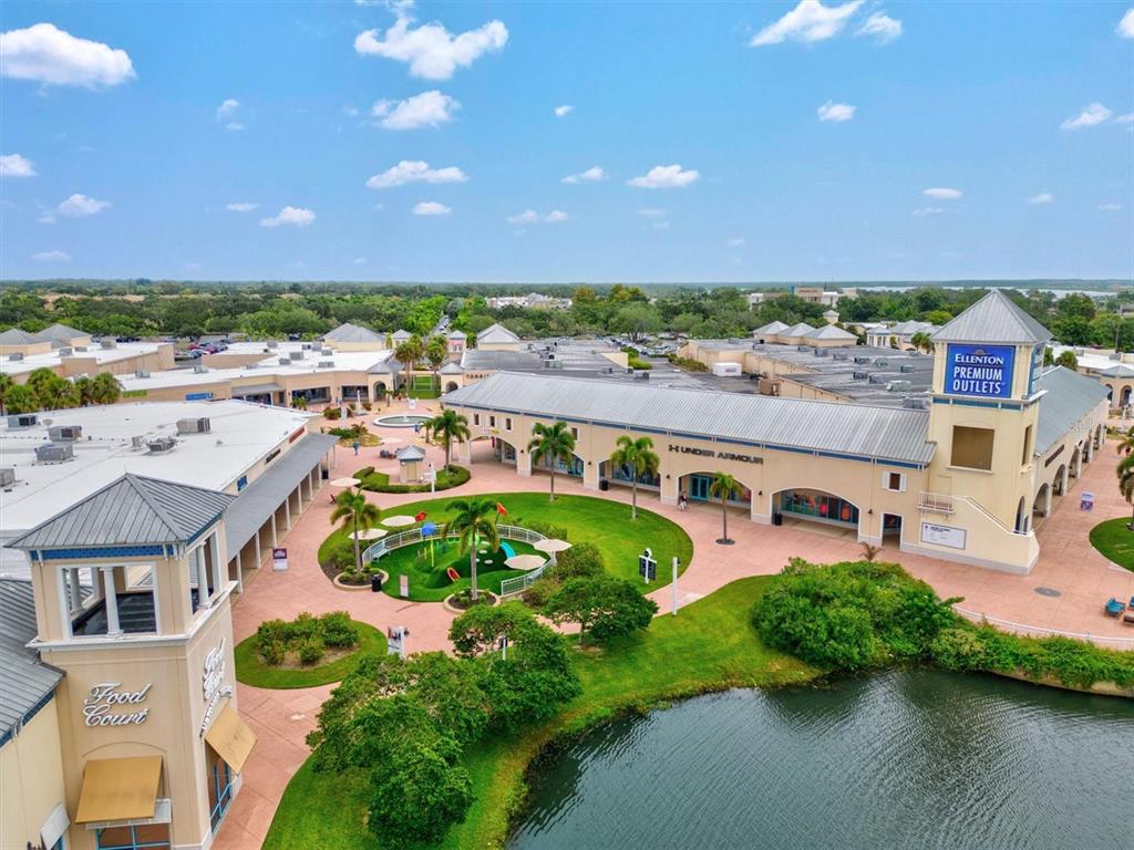 7923 111th Terrace East Parrish, FL 34219 - Photo 65 of 80 an aerial view of a house with a garden and lake view