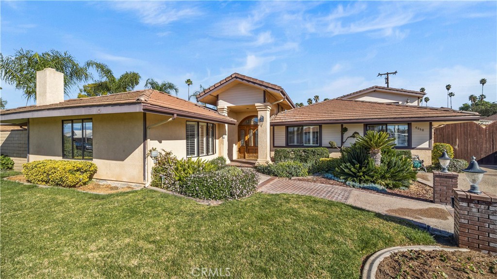 4968 Chapala Drive Riverside, CA 92507 - Photo 1 of 1 a front view of a house with garden