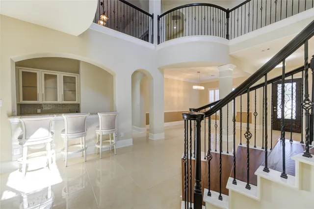 a view of entryway and hall with dining room