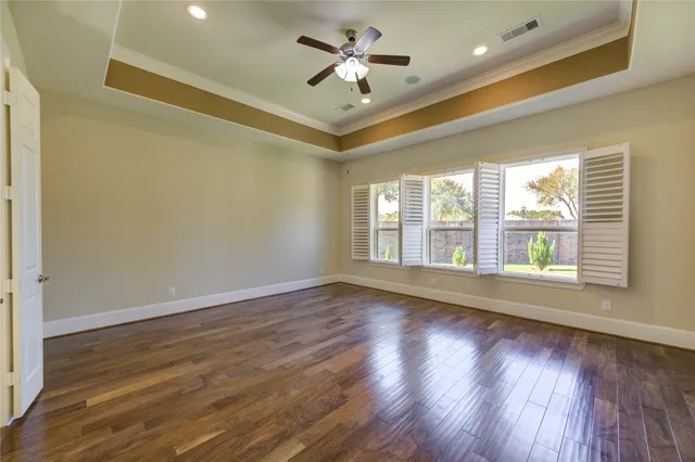 a bathroom with a sink a toilet a mirror a bathtub and shower