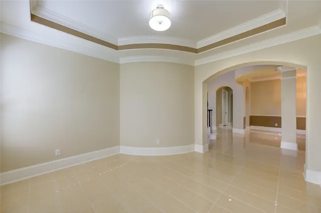 a living room with furniture and a mirror