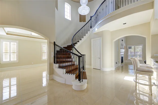 an empty room with closet and natural light