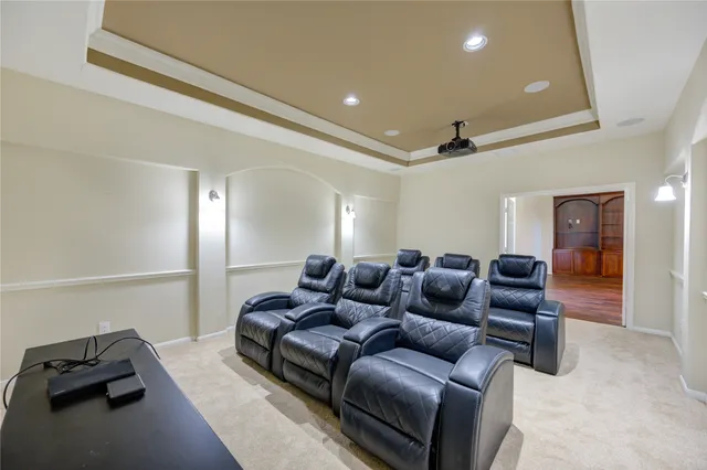 a bathroom with a sink a toilet a mirror and shower