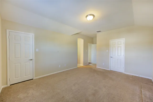 a bathroom with a granite countertop sink a toilet and a mirror