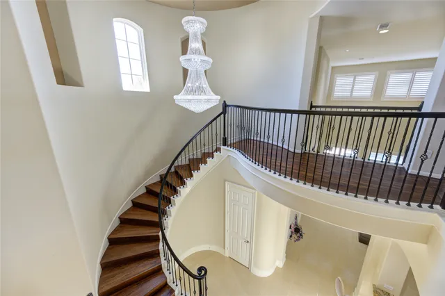 a view of a house with a yard patio and swimming pool