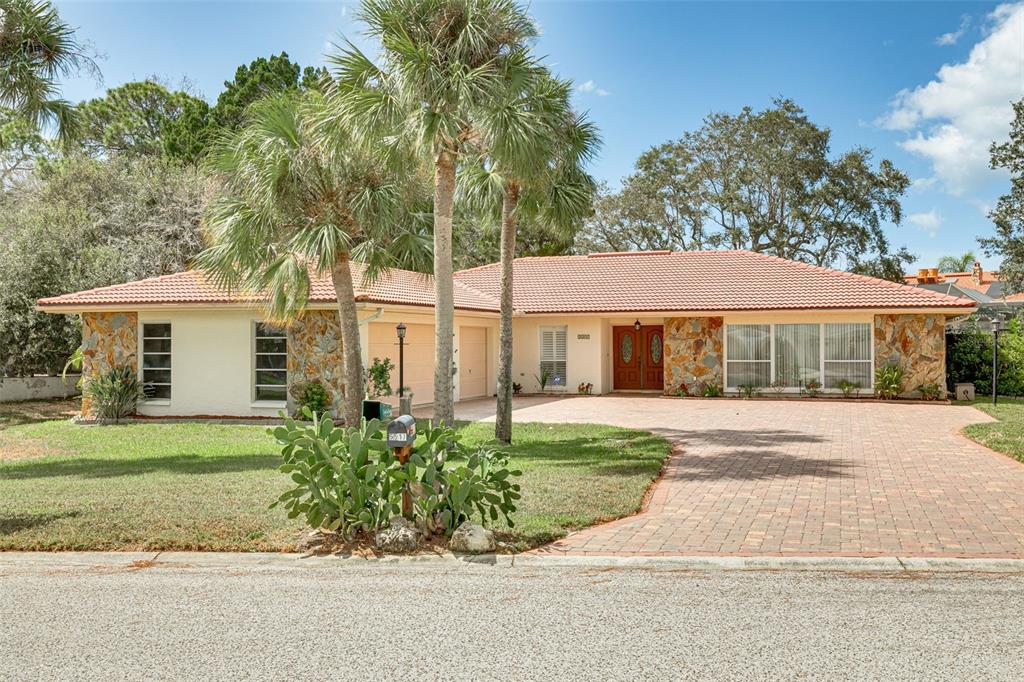 5517 Gridley Lane New Port Richey, FL 34652 - Photo 1 of 1 Front of home with paver drive and 3 car garage
