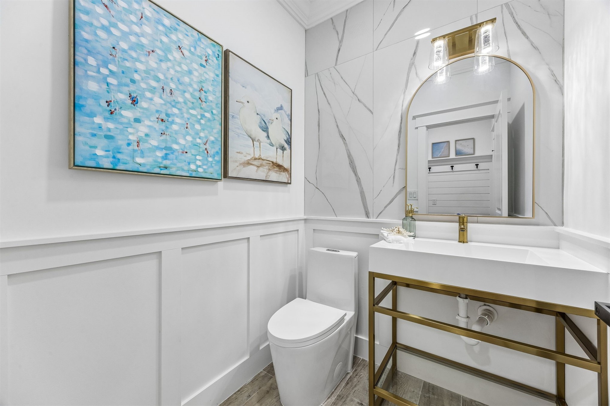 95121 North Ellis Landing Road Fernandina Beach, FL 32034 - Photo 30 of 37 a bathroom with a toilet a sink and mirror