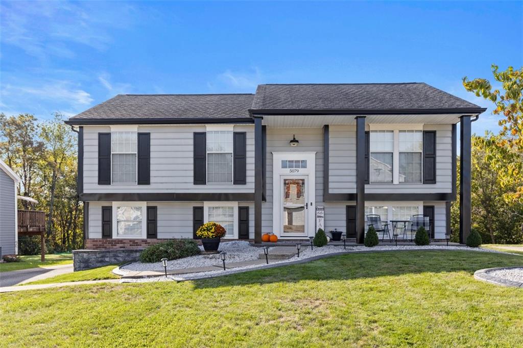 5079 Windriver Drive McKees Rocks, PA 15136 - Photo 1 of 50 a front view of a residential apartment building with a yard