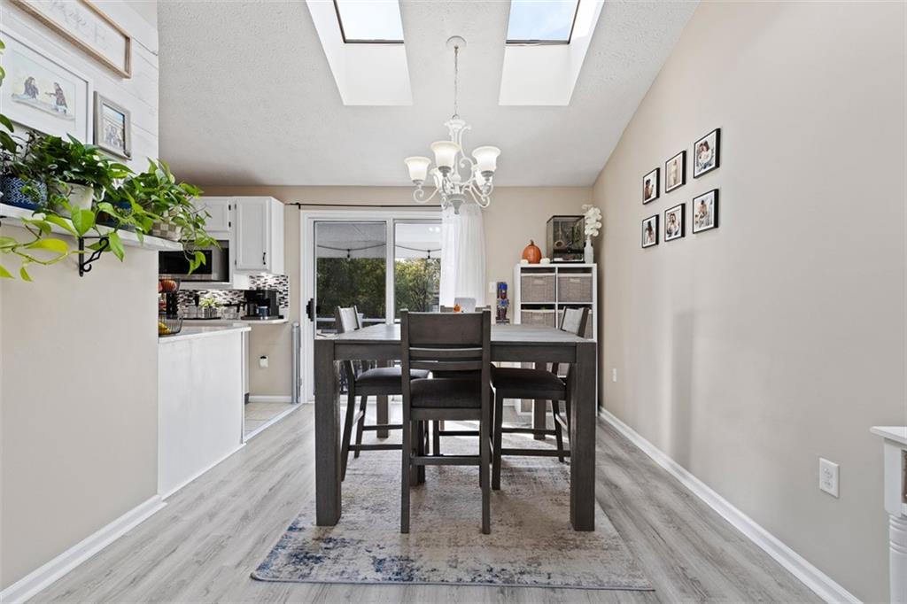 5079 Windriver Drive McKees Rocks, PA 15136 - Photo 11 of 50 a view of a dining room with furniture and chandelier