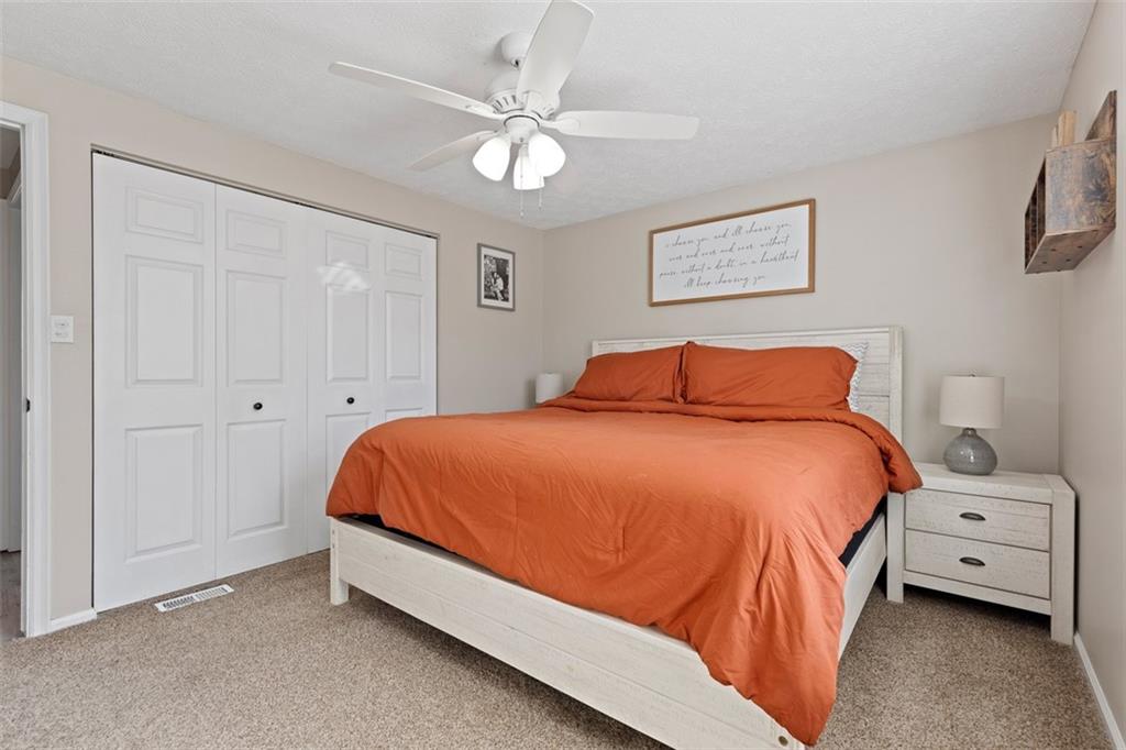 5079 Windriver Drive McKees Rocks, PA 15136 - Photo 18 of 50 a bedroom with a bed and a chandelier