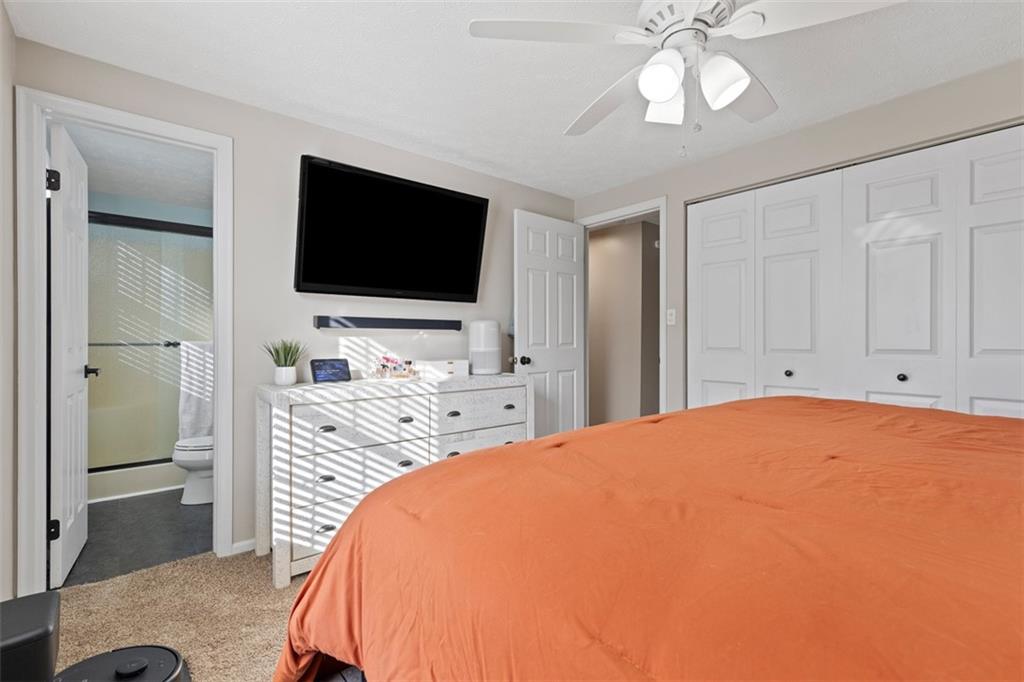 5079 Windriver Drive McKees Rocks, PA 15136 - Photo 19 of 50 a bedroom with a bed and a flat screen tv