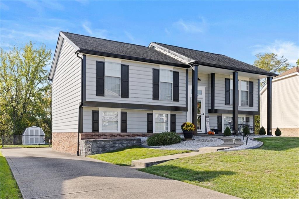 5079 Windriver Drive McKees Rocks, PA 15136 - Photo 2 of 50 a front view of a house with swimming pool and glass windows