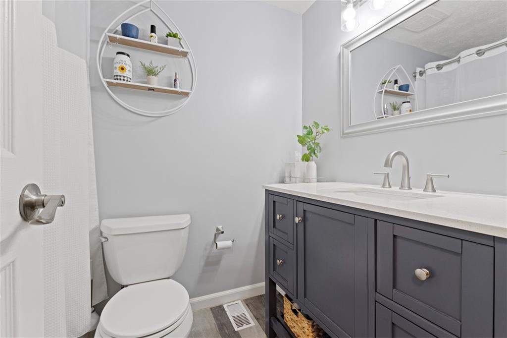 5079 Windriver Drive McKees Rocks, PA 15136 - Photo 26 of 50 a bathroom with a toilet sink and mirror
