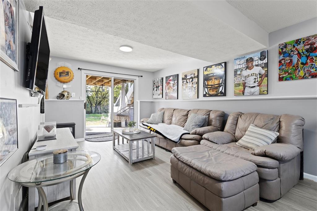 5079 Windriver Drive McKees Rocks, PA 15136 - Photo 28 of 50 a living room with furniture and a flat screen tv