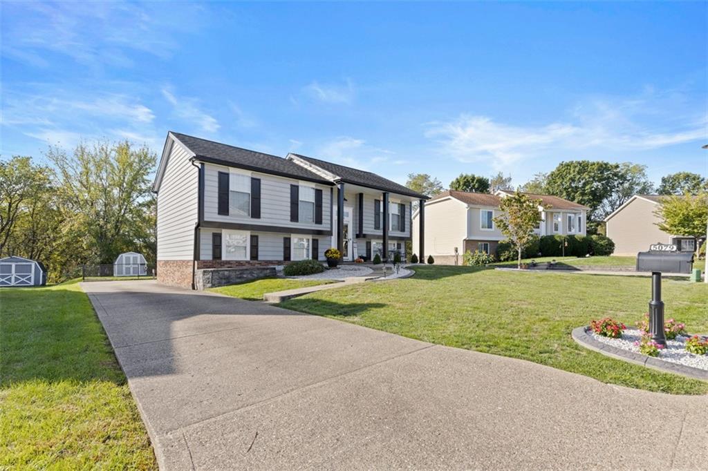 5079 Windriver Drive McKees Rocks, PA 15136 - Photo 3 of 50 a view of a house with a swimming pool and a yard